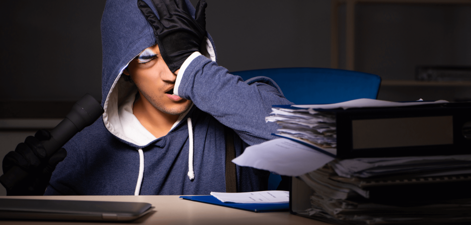 Man facepalming in hoodie